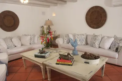 a living room with a couch and a coffee table at Hotel Casa Quero in Cartagena de Indias
