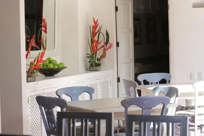 a dining room with a table and chairs at Hotel Casa Quero in Cartagena de Indias