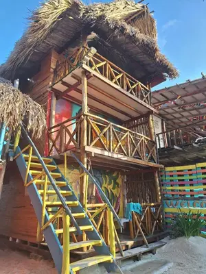 a building with a staircase in front of it at The Wizard & Bar BARU in Playa Blanca