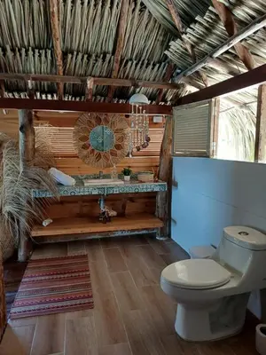 a bathroom with a toilet and a sink at The Wizard & Bar BARU in Playa Blanca