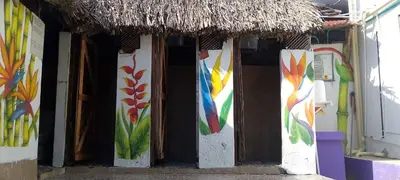 a building with colorful paintings on the side of it at The Wizard & Bar BARU in Playa Blanca