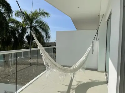 a hammock on the balcony of a house at Apartamento Cartagena Morros Epic 23 in Cartagena de Indias