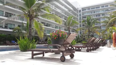a row of lounge chairs in front of a building at Morros Epic 222 in Cartagena de Indias