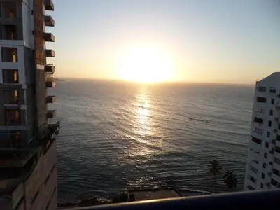 a view of the ocean at sunset from a building at Edificio Marina del Rey Cartagena in Cartagena de Indias