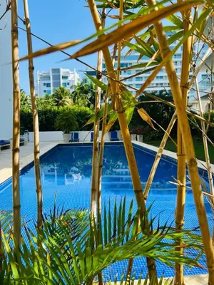 a view of a swimming pool from under an umbrella at MORROS VITRI Luxury in Cartagena de Indias
