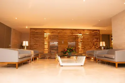 a lobby with couches and a table in a building at Hotel Capilla del Mar in Cartagena de Indias