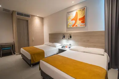 a hotel room with two beds in a room at Hotel Zi One Luxury in Cartagena de Indias