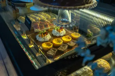a display case with a bunch of food on display at GHL Hotel Barranquilla in Barranquilla