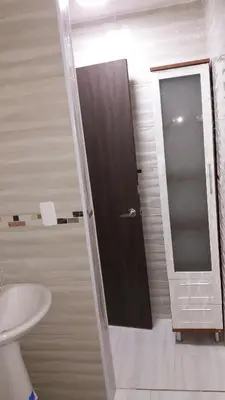 a bathroom with a toilet and a sink and a mirror at Caribe a Vista in Cartagena de Indias