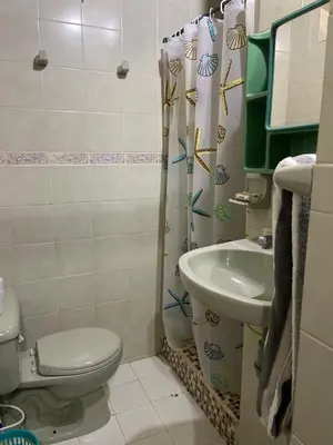 a bathroom with a toilet and a sink at Luna azul in San Bernardo del Viento