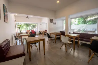 a restaurant with tables and chairs in a room at Hotel Stil Cartagena in Cartagena de Indias