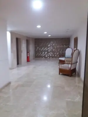 an empty room with chairs and a stone wall at Hermosa vista Mar in Cartagena de Indias