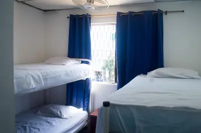 two bunk beds in a room with a window at Hotel Paseo Bolivar in Cartagena de Indias