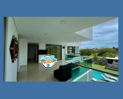 a modern house with a view of a swimming pool at Palmares Beach in Tubará