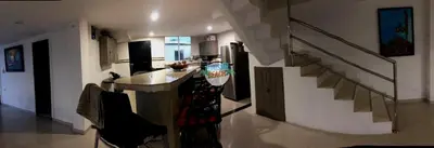 a room with a kitchen and a staircase in a house at Blue Gold Beach in Juan de Acosta