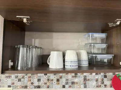 a shelf with a bunch of cups on it at Deusades Apartamentos in Cartagena de Indias