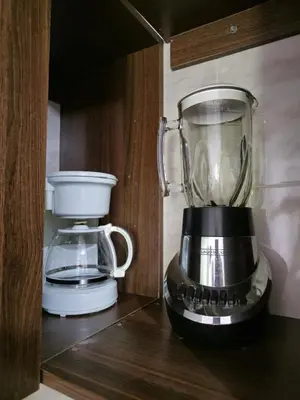 a blender sitting on a shelf next to a coffee maker at Deusades Apartamentos in Cartagena de Indias