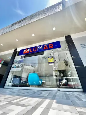 a walmart store with a blue chair in the front at Hostal Lumar in Barranquilla