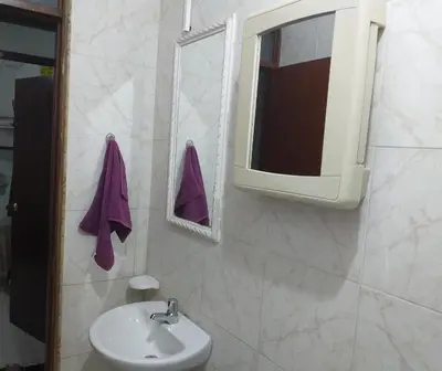 a bathroom with a sink and a mirror at Comfort La Española in Cartagena de Indias