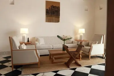 a living room with a couch and chairs at Casa Pestagua Relais Châteaux in Cartagena de Indias