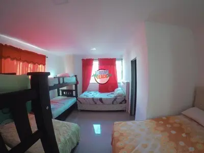 a bedroom with two bunk beds and a window at Special Life Beach in Tubará