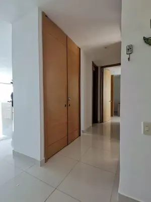 a hallway with a large wooden door in a building at Karibana Espectacular in Cartagena de Indias