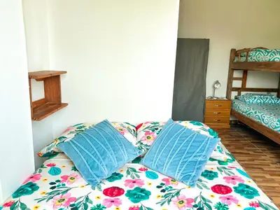 a couch with pillows on it in a room at La Terraza de Estella in Cartagena de Indias