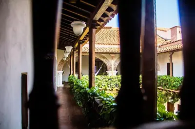 a view of a building with a courtyard with plants at Hotel Boutique Casa Del Arzobispado in Cartagena de Indias