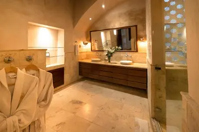 a large bathroom with a sink and a mirror at Hotel Boutique Casa Del Arzobispado in Cartagena de Indias