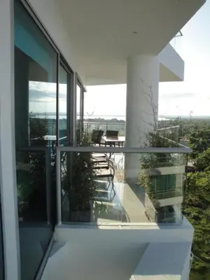 a balcony of a house with a table and chairs at Apartamento Cartagena Edif Seaway 935 - Apto 501 Fotos Instagram apartamentocartagena501 in Cartagena de Indias