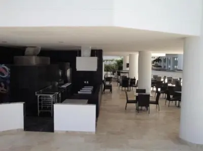 a room with tables and chairs in a building at Apartamento Cartagena Edif Seaway 935 - Apto 501 Fotos Instagram apartamentocartagena501 in Cartagena de Indias