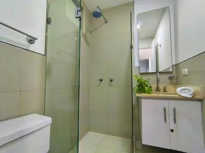 a bathroom with a shower and a toilet and a sink at Morros Epic in Cartagena de Indias