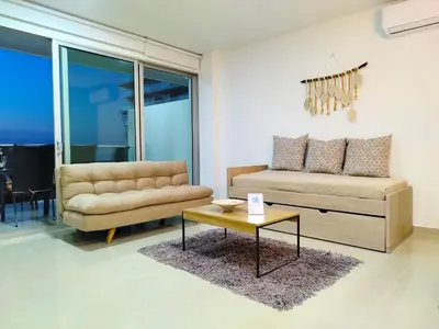 a living room with a couch and a coffee table at Morros Epic in Cartagena de Indias