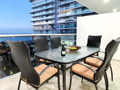 a table and chairs on the balcony of a building at Morros Epic in Cartagena de Indias