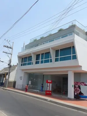 a white building on the side of a street at Hostal Casa de Barajas in Cartagena de Indias