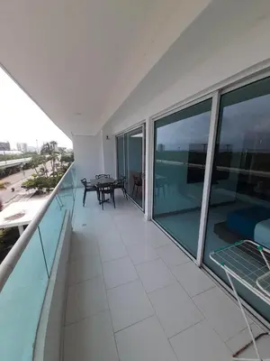a balcony with a table and a view of the ocean at Morros con acceso directo a la playa in Cartagena de Indias