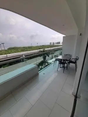 a balcony with a table and chairs in a building at Morros con acceso directo a la playa in Cartagena de Indias