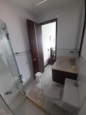a bathroom with a glass shower and a sink at Morros con acceso directo a la playa in Cartagena de Indias