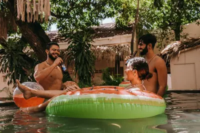 a group of people in the water in a pool at Viajero Cartagena - Centro Hostel in Cartagena de Indias