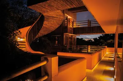a night view of a building with stairs and lights at Hotel Las Islas in Baru