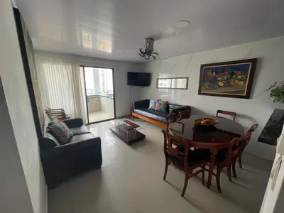 a living room with a couch and a table at Apartamento por temporadas en Bocagrande Cartagena in Cartagena de Indias
