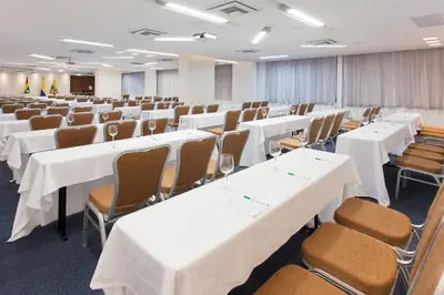 a conference room with white tables and chairs at Holiday Inn Cartagena Morros by IHG in Cartagena de Indias