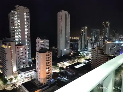 a city skyline at night with tall buildings at luxuriuso apartament in Cartagena de Indias