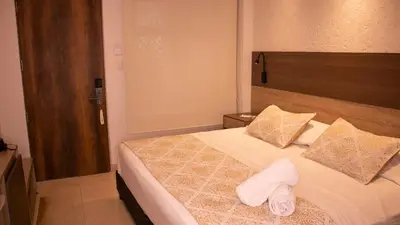 a bedroom with a bed with towels on it at Cartagena Royal Hotel Boutique in Cartagena de Indias
