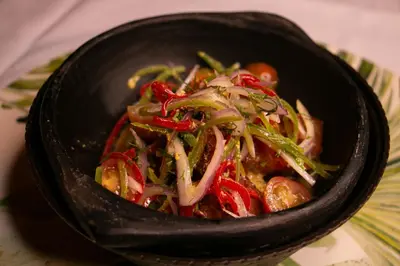 a black bowl of food with vegetables in it at Cartagena Royal Hotel Boutique in Cartagena de Indias