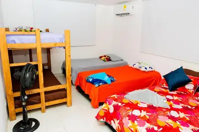 a bedroom with two bunk beds and a ladder at Departamento Bocagrande cerca a playas in Cartagena de Indias