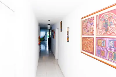a hallway with a large painting on the wall at Departamento Bocagrande cerca a playas in Cartagena de Indias