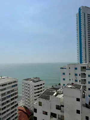 a view of the ocean from a city with buildings at Palmera Beach in Cartagena de Indias