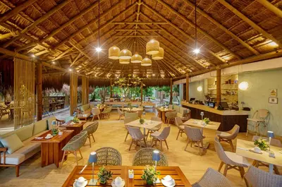 an image of a restaurant with tables and chairs at Hotel San Pedro de Majagua in Isla Grande