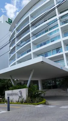 a large white building with a monkey painted on it at morros 3 in Cartagena de Indias